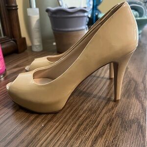 Nine West nude pumps.